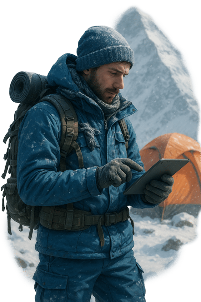 Hiker on a mountain expedition at basecamp with a tablet