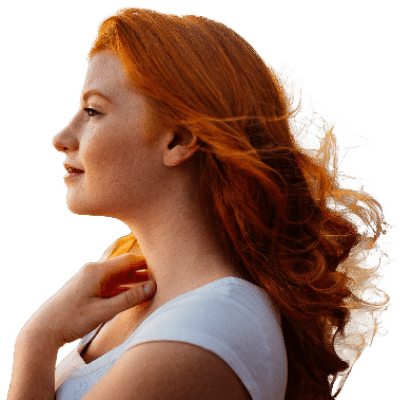 woman with red hair looking into the sunset representing the Lover Brand Archetype